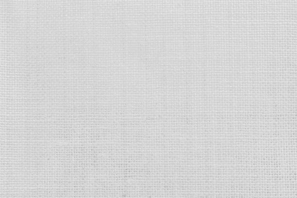 istock Jute hessian sackcloth woven texture pattern background in light white color textile. White canvas fabric, linen cotton cloth rough texture background of watercolour paper craft blank cardboard empty. 2184435936