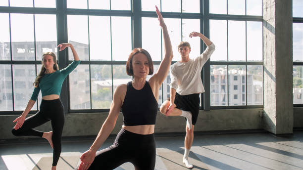 istock Physical training yoga recreation coach group gym 2184436421