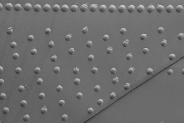 Abstract metallic background with rivets. Armor protection of the technique.