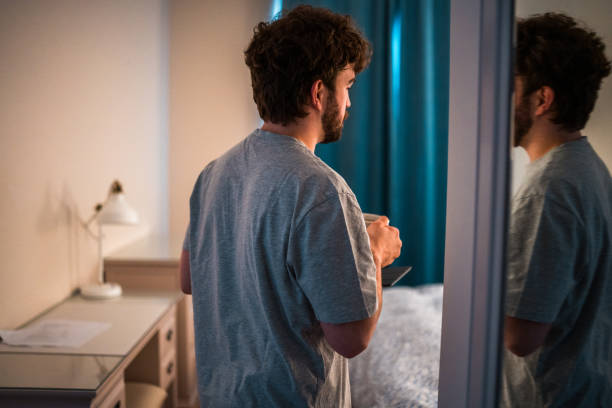 istock Caucasian Male Struggling with Sleep Disorder in Bedroom Setting 2184439799