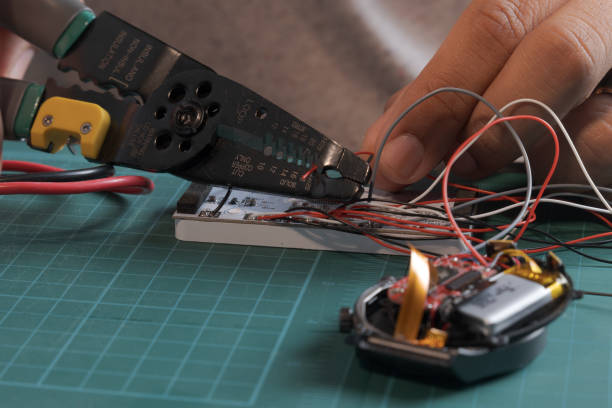 istock A person is working on a device with a wire cutter 2184441019