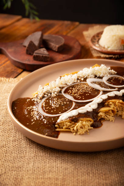 istock Poblano mole enchiladas homemade mexican food 2184441532