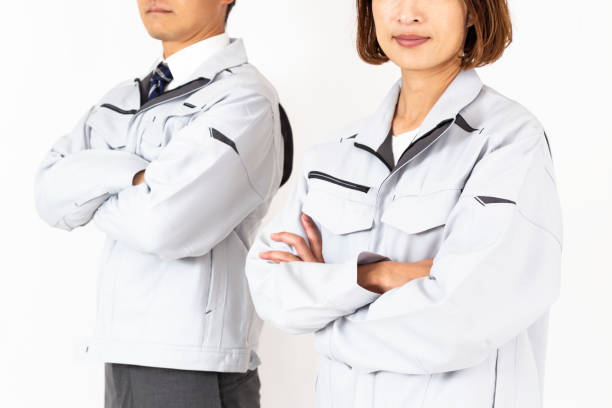 istock Men and women in work clothes with their arms folded 2184442992
