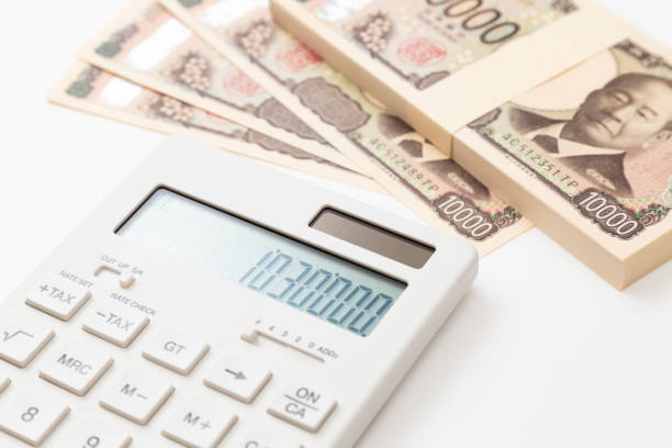1,030,000 yen and a calculator on a white background.The 1.03 million yen barrier.Japan's tax system.Spouse deduction.