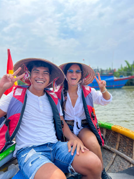 istock Happy Couple on a Traditional Vietnamese Boat Ride 2184448241