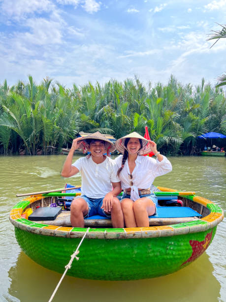istock Happy Couple on a Traditional Vietnamese Boat Ride 2184448287