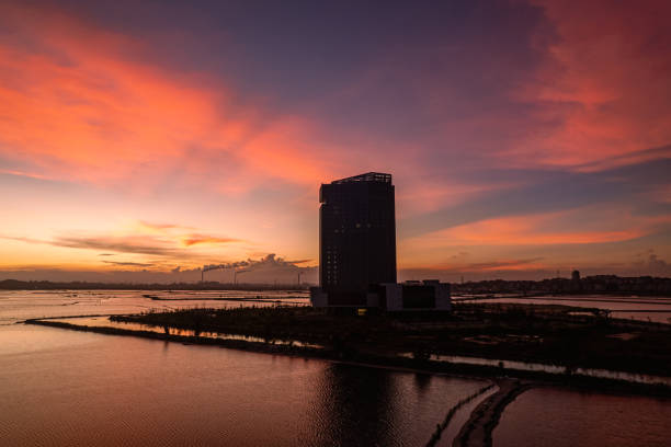 Aerial view of mudflat and buildings in sunset