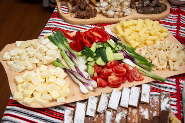 istock Peasant platter from Transylvania with cheese, onions, tomatoes, cucumbers and smoked bacon 2184459267