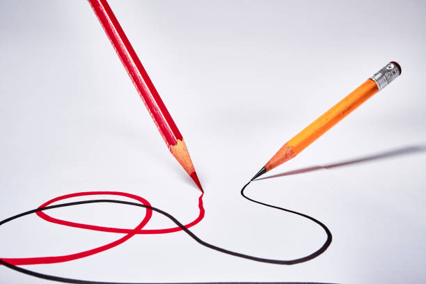 istock Red and black pencils drawing swirling lines 2184461588