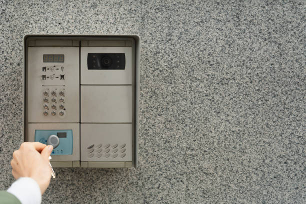 istock Woman's hand with fob next to intercom 2184462540
