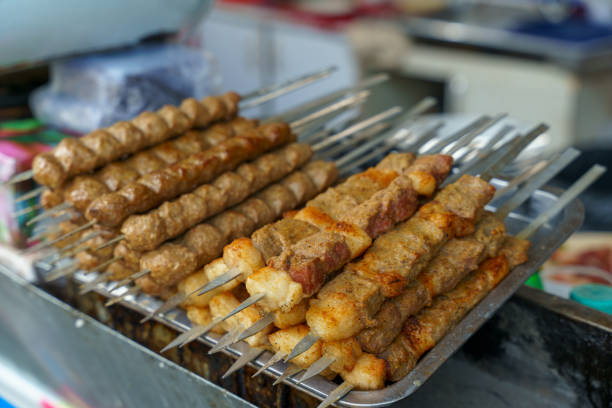 A tray of meat skewers is displayed on a table in Tashkent, Uzbekistan