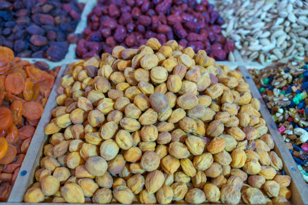 Vibrant selection of dried fruits showcases prunes, apricots, and dates.