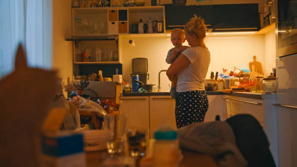 istock Caucasian Mother and Infant Enjoying Kitchen Time 2184464322