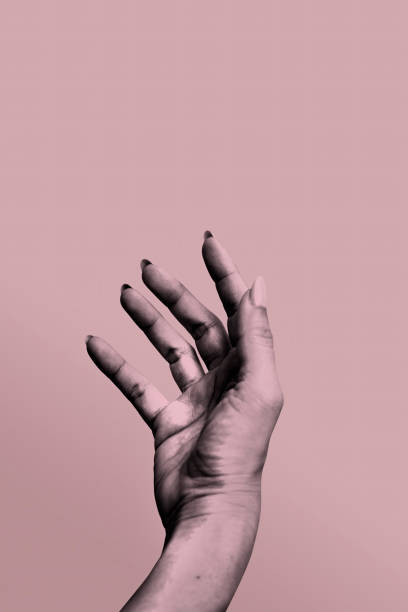 istock Digital collage hand object to outstretched hand isolated on a pink background 2184469089