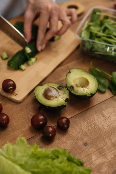 istock The process of making a salad from fresh vegetables 2184473788
