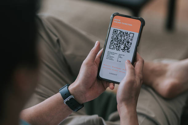 istock Asian Chinese man using mobile app cinema movie e-ticketing reservation 2184476670