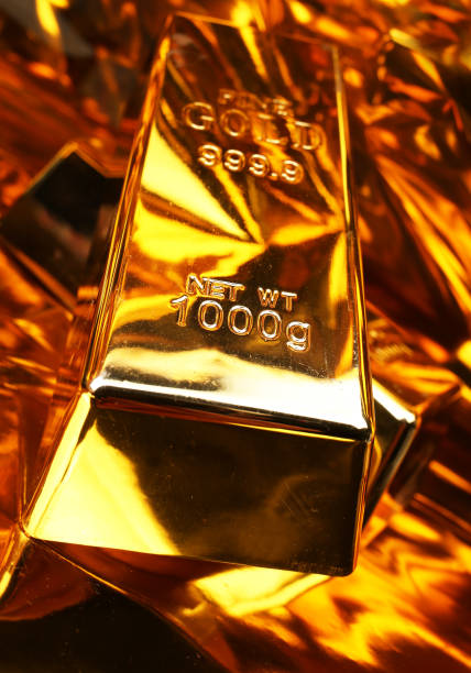 istock Two gold bars on a golden background 2184479656
