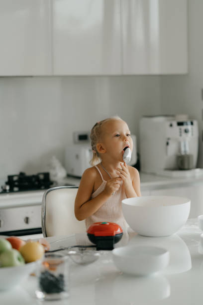 istock Mother and daughter preparing food in kitchen 2184483276