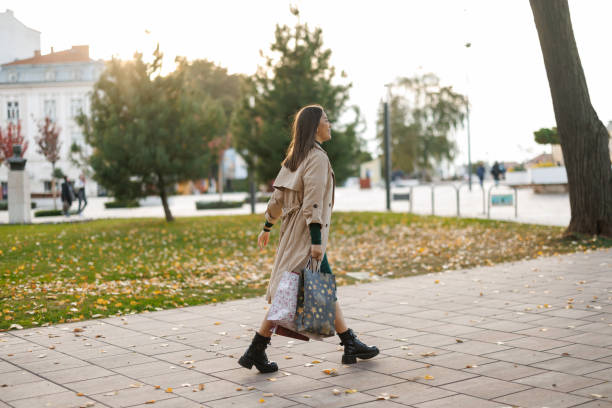 istock Happy woman on the way back from shopping 2184484953