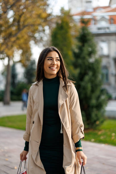 istock Happy woman on the way back from shopping 2184485149