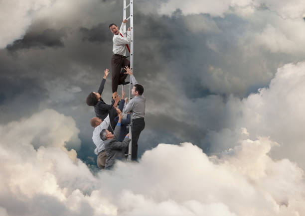 Business people climb the corporate ladder, through clouds