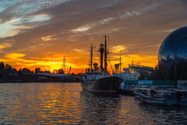 View of Pregolya River and ships in Kaliningrad at sunset. Russia.