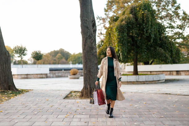istock Happy woman on the way back from shopping 2184485811