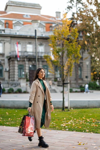 istock Happy woman on the way back from shopping 2184486000