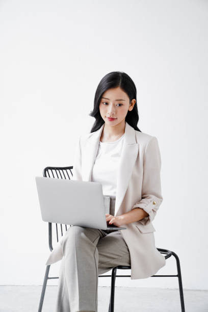 istock Beautiful woman working in an office 2184486825