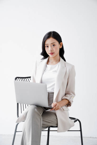 istock Beautiful woman working in an office 2184486827