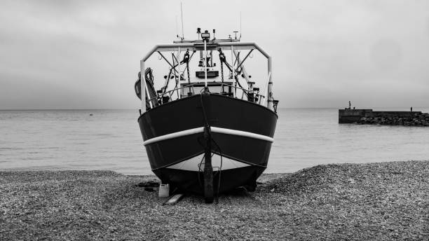 istock Fishing Boat on the Beach 2184492666
