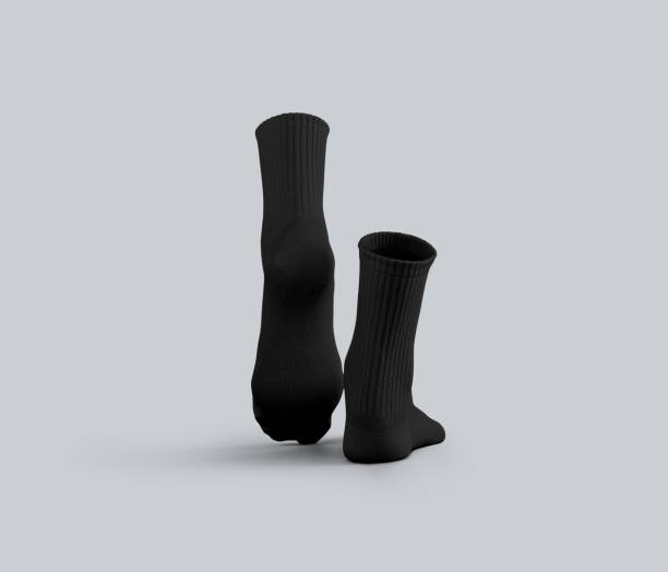 istock Black medium socks mockup 3D rendering, one foot stretched, back view, isolated on background. 2184492772
