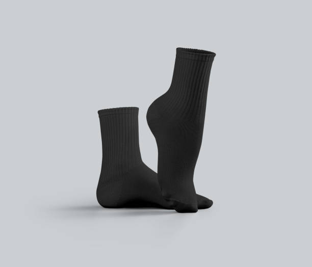 istock Black medium socks mockup 3D rendering, one foot stretched, side view, isolated on background. 2184492876