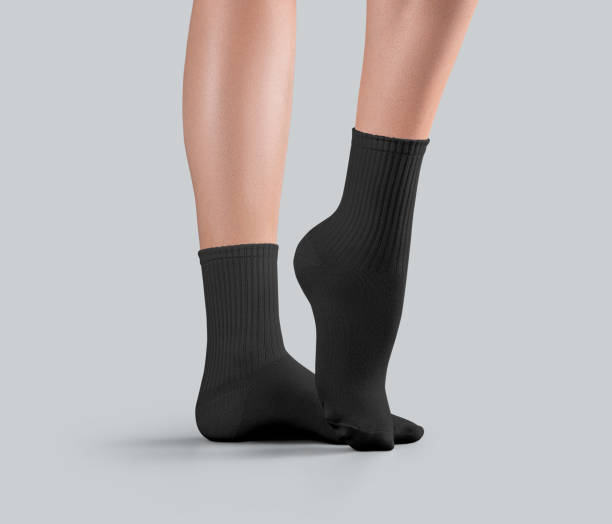 istock Mockup of black medium socks on women's legs, side view, ankle stretched, presentation for design, pattern, branding, advertising. 2184492951