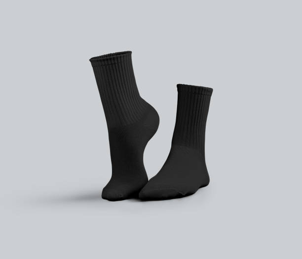 istock Mockup of black medium socks with textured elastic band, 3D rendering, front view, one ankle stretched, for design, branding, advertising. 2184493031