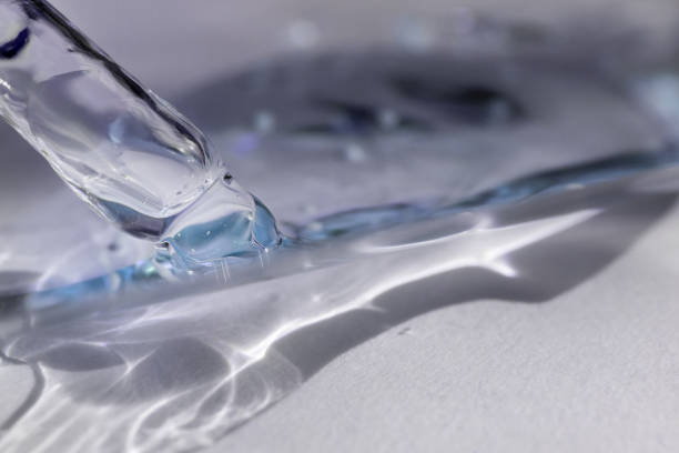 istock A drop of cosmetic aromatic oil drips from the pipette. Front view. 2184493659