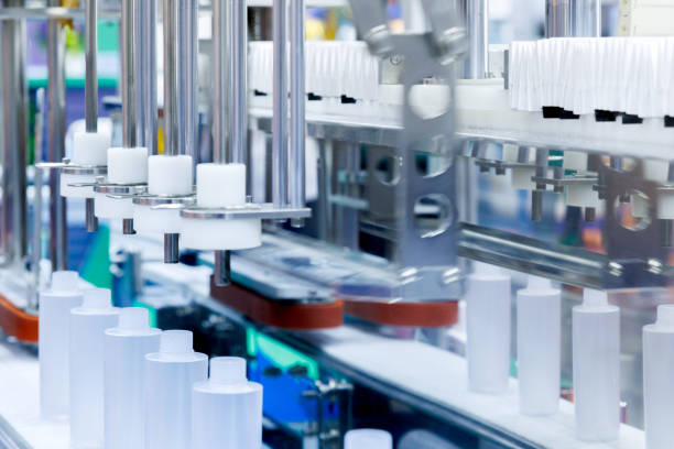 istock robot arm moving plastic bottle to conveyor belt of auto capping and labeling machine at cosmetic and skin care manufacturing. cosmetic industry and ai technology machinery concept. 2184494697