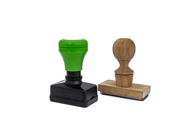 Plastic and wooden rubber stamps on white background