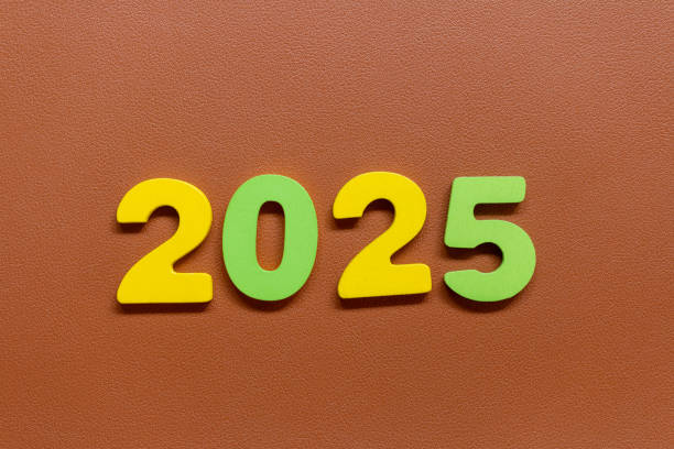 istock Colorful numbers 2025  on a brown textured background 2184499908