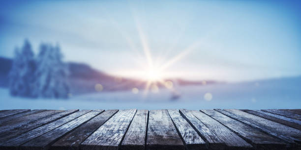 istock Wintry landscape and wooden walkway background 2184501061