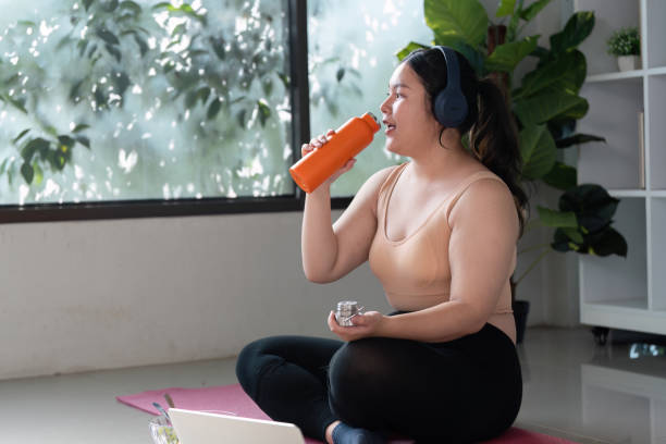 istock Woman Practicing Mindful Relaxation with Yoga and Hydration at Home for Enhanced Wellness and Balance 2184503195