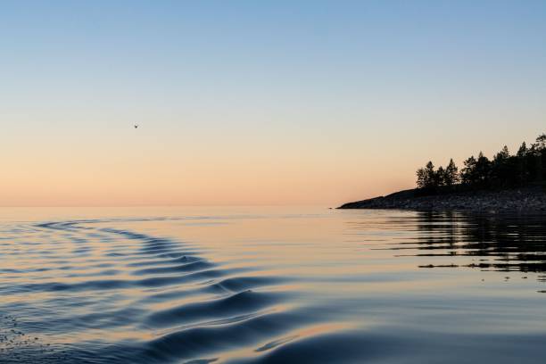 istock Tranquil sunset over calm sea with gentle waves. 2184503570