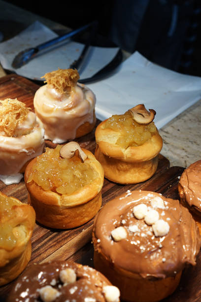 Close up Brioche bread topped with pecan nut and sweet toppings