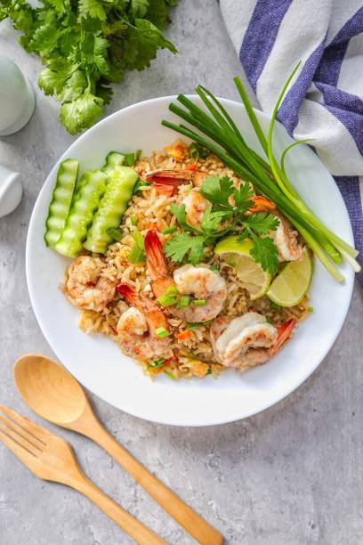 istock Fried rice with shrimps on a white plate, top view table 2184506427