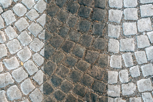 istock Pedestrian zebra crossing pattern on cobble stone road 2184507480