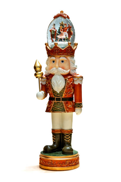 istock Nutcracker statue with snow globe on head for Christmas decor, isolated on white background. Place for text 2184509029