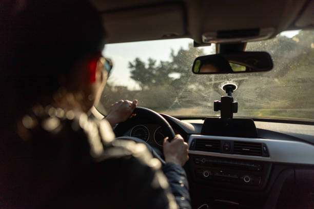 istock Woman driving car through nature 2184509147