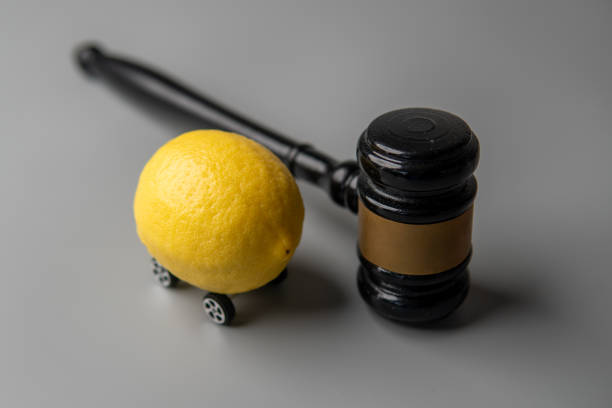 istock A lemon with wheels and a judge gavel. 2184509801