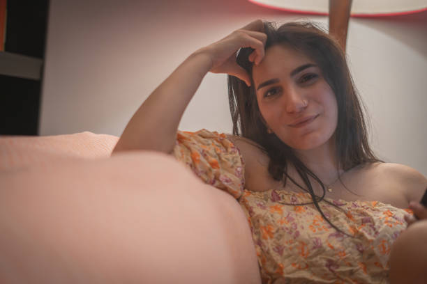istock Relaxed Woman Resting on Couch at Home 2184510501