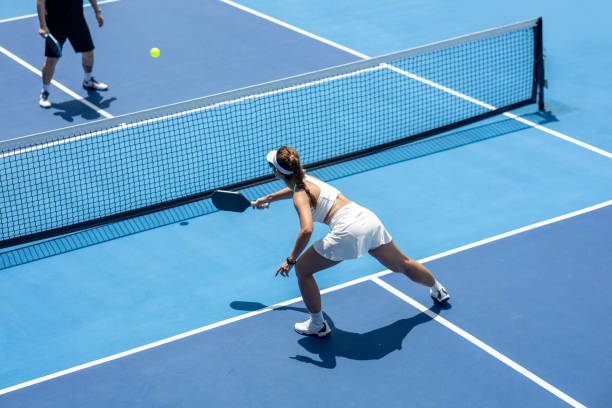 istock Female Pickleball Player At Net 2184510670